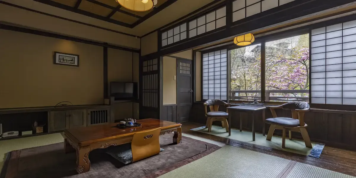 A traditional first-floor Japanese-style guest room at Okyakuya; guest rooms do not have a bath or shower