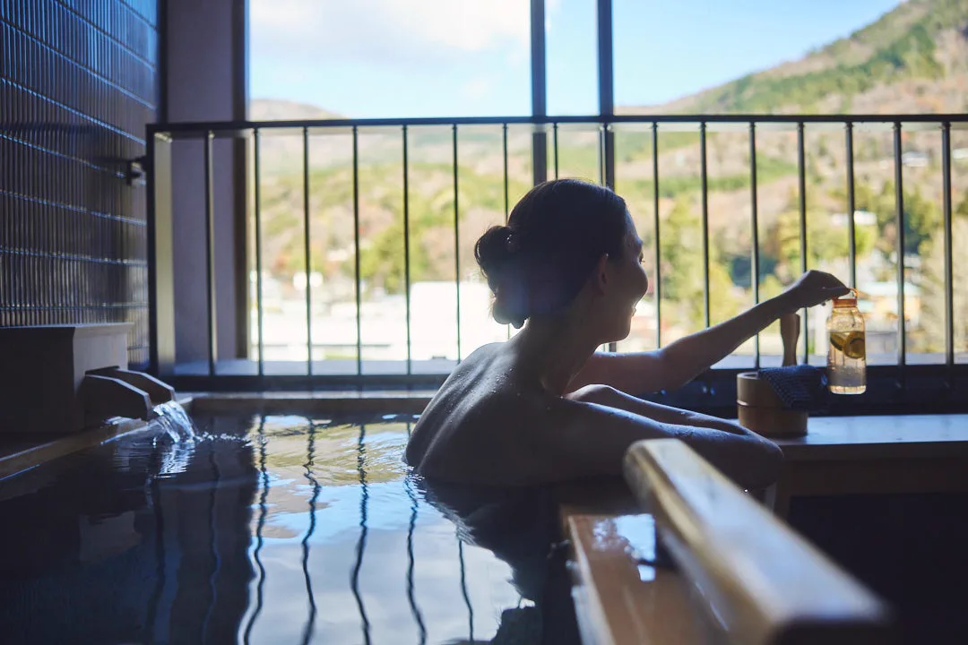 Private natural hot-spring bath in a riverside guest room at Hotel Indigo Hakone Gora