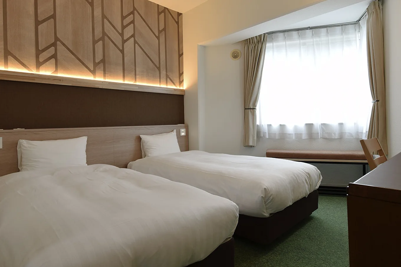 A twin room at the renovated adex Inn